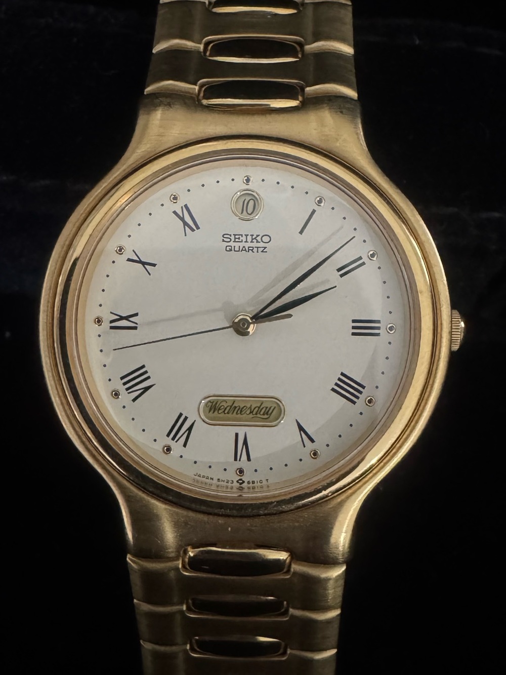 Seiko Gold Tone Watch with White Dial and Roman Numerals